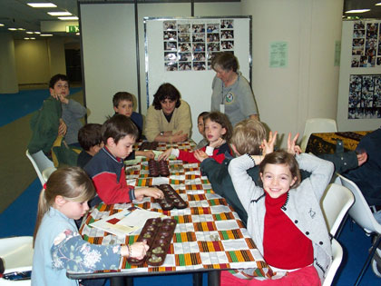 Children having fun playing Oware