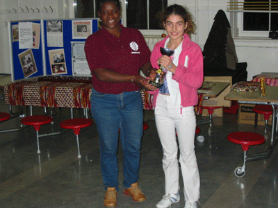 Junior UK Oware Open Champion 2003, Rediye Behzat receiving her winners trophy. 