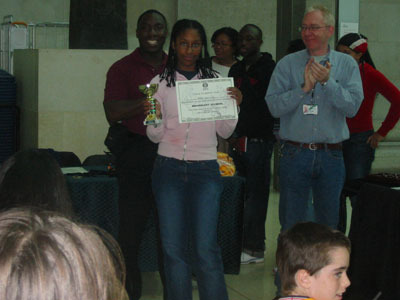 Jordan-Marie Caton winner of the competition receiving her prize.